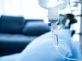 Close up of set vitamin iv fluid intravenous drip saline drop near the patient bed in hospital room. Royalty Free Stock Photo