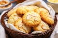 close up of several almond cookies in a woven basket