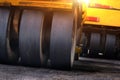 Close-up of several asphalt paving machines working on the road. Horizon tilt Royalty Free Stock Photo