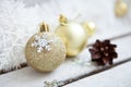 Close up of several Christmas gold glass baubles