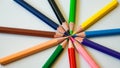 Close up of several colored pencils arranged on paper Royalty Free Stock Photo