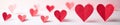 Close up of several red paper hearts against white, asset, macro