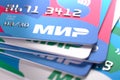 Close-up of several Russian MIR plastic bank cards in different colors. MIR credit bank cards, selected focus. Moscow