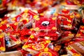 Close-up of several vibrant red and yellow decorative bags in an Asian style