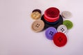 Close up sewing buttons stacked scattered assorted colors Royalty Free Stock Photo