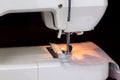 Close up sewing fabric with white sewing machine Royalty Free Stock Photo