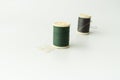 Close up of sewing items,Spool of thread, needle and button Royalty Free Stock Photo