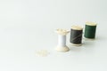 Close up of sewing items,Spool of thread, needle and button Royalty Free Stock Photo
