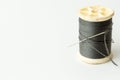 Close up of sewing items,Spool of thread, needle and button Royalty Free Stock Photo