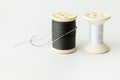 Close up of sewing items,Spool of thread, needle and button