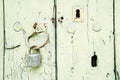 Close-up of shabby painted wooden door with hanging padlock and keyhole Royalty Free Stock Photo