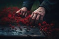 Close-Up of Shadowy Casket with Red Blooms, Hand of an Elderly Mourner