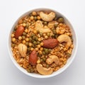 Close-Up of Shahi Mixture in a white ceramic bowl, made with peanut, cashew, almonds. Indian spicy snacks Namkeen.