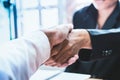 Close-up Shake hands lawyers in office. Counseling and Give an advice between private and government officials to find a fair