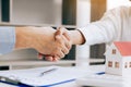 Close up of shaking hands with customer and real estate broker a Royalty Free Stock Photo