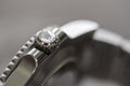 Close-up, shallow focus image of a famous, Swiss manufactured men`s diving watch. Royalty Free Stock Photo