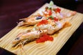 Close-up shallow focus shot of Japanese cuisine, cooked botan shrimp dish. Top with Tobiko(flying fish roe)