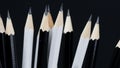 Sharpened tip of black and white pencils on black background Royalty Free Stock Photo