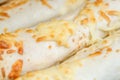 Close-up of shaurma covered with cheese, macro view Royalty Free Stock Photo