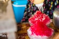 Close up the shave ice with red sugar syrup, topping with sweetened condensed milk Royalty Free Stock Photo