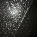 Close-up of a sheet of bubble wrap with evenly spaced, transparent air-filled bubbles. Royalty Free Stock Photo