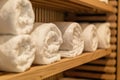 Close up of shelf with rolled bath towels at hotel spa Royalty Free Stock Photo