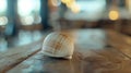 Close up of a shell on a wooden table, perfect for beach-themed designs Royalty Free Stock Photo
