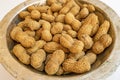 Shelled peanuts in metal bowl Royalty Free Stock Photo