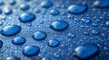 Close-up of shimmering blue water droplets on reflective surface. Royalty Free Stock Photo