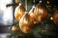 close-up of shimmery gold baubles on a christmas tree