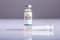 Close-up Of Shingles Vaccine And Syringe