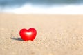 Close-up of A Shining Red Heart on Beach Sand Royalty Free Stock Photo