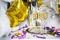 Close up of shiny glasses of champagne over black, white, golden and silver background Royalty Free Stock Photo