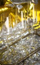 Close up of shiny glasses of champagne over golden and silver balloons background Royalty Free Stock Photo