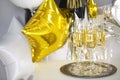 Close up of shiny glasses of champagne over party background Royalty Free Stock Photo