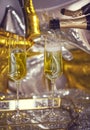 Close up of shiny glasses of champagne over party background Royalty Free Stock Photo