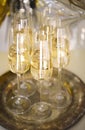 Close up of shiny glasses of champagne over party background Royalty Free Stock Photo