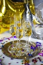 Close up of shiny glasses of champagne over party background Royalty Free Stock Photo