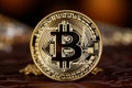 Close-up of shiny gold bitcoin digital currency with selective focus and blurred background