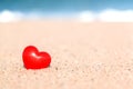 Close-up of A Shiny Red Heart on Beach Sand Royalty Free Stock Photo