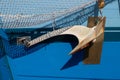 Close up of a ship anchor on a blue hull Royalty Free Stock Photo