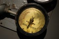 Close-up of ship gyro compass engine control indicators. Iron, brass and glass