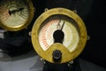 Close-up of ship\'s engine control indicators with duplicate dials. Iron, brass and glass Royalty Free Stock Photo