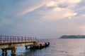 Close-up of the shipping pier on the sea at dawn. Royalty Free Stock Photo