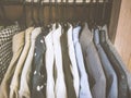 Close up of shirts with different sizes and color hanging on the rack