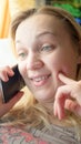 Close up of shocked woman hearing bad news over phone, scared female amazed by negative message received talking on cell Royalty Free Stock Photo