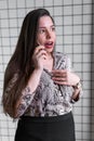 Close up of shocked woman hearing bad news over phone, scared female amazed by negative message received talking on cell Royalty Free Stock Photo