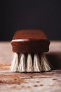 Close up of a shoe shine brush on a rustic background Royalty Free Stock Photo