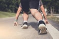 Close up on shoes, athlete runner feet running on track to begin