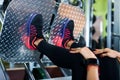 Close up shoes of a fit young woman doing leg press in the gym Royalty Free Stock Photo